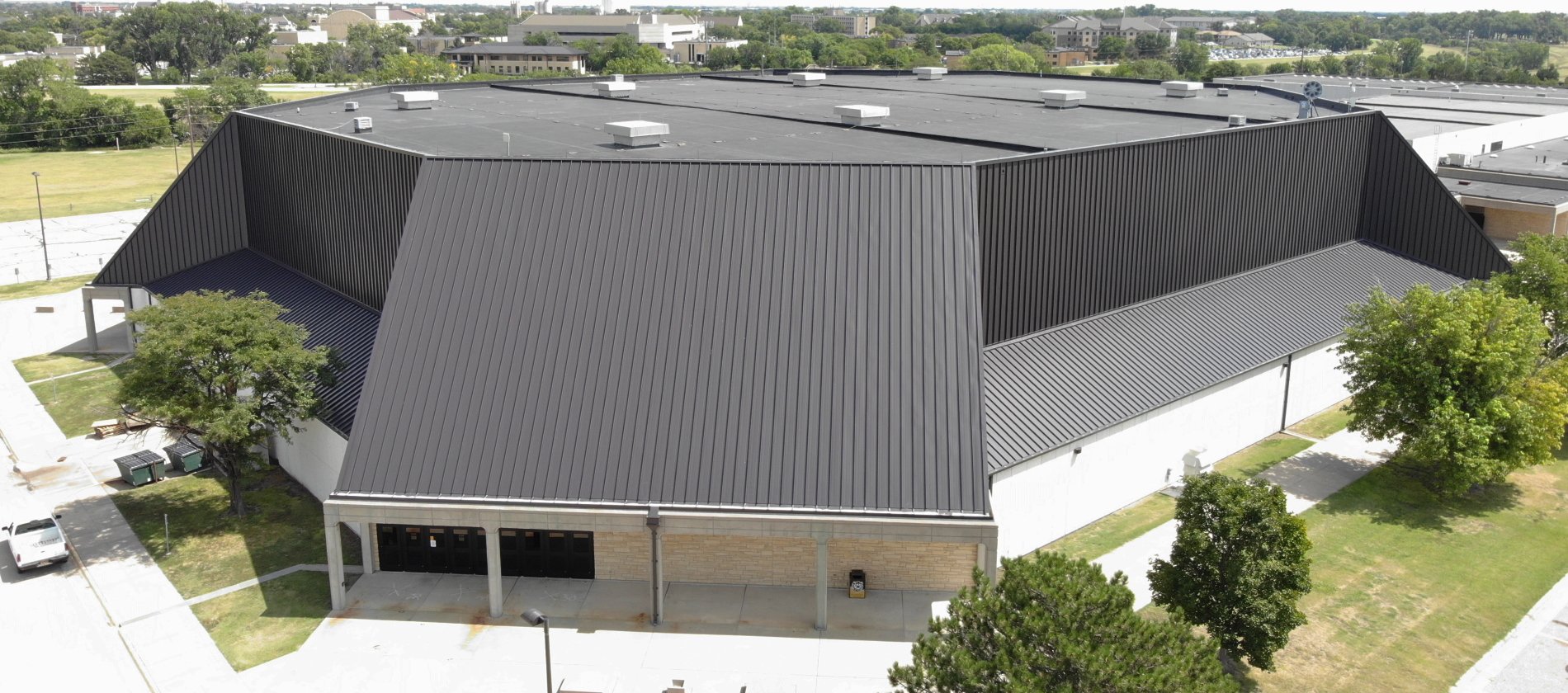 238T Symmetrical Panel Recovers Coliseum Roof and Wall