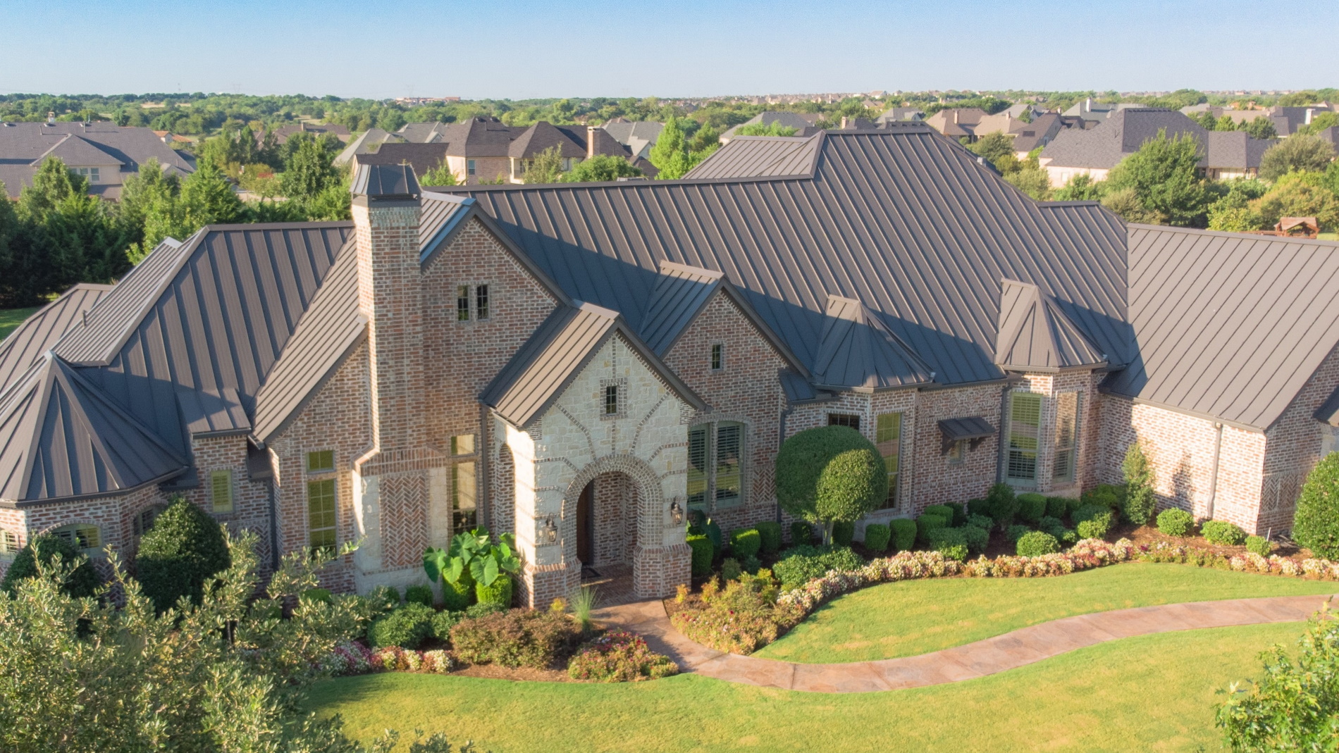 Roofer chooses McElroy Metal system for his own Texas home