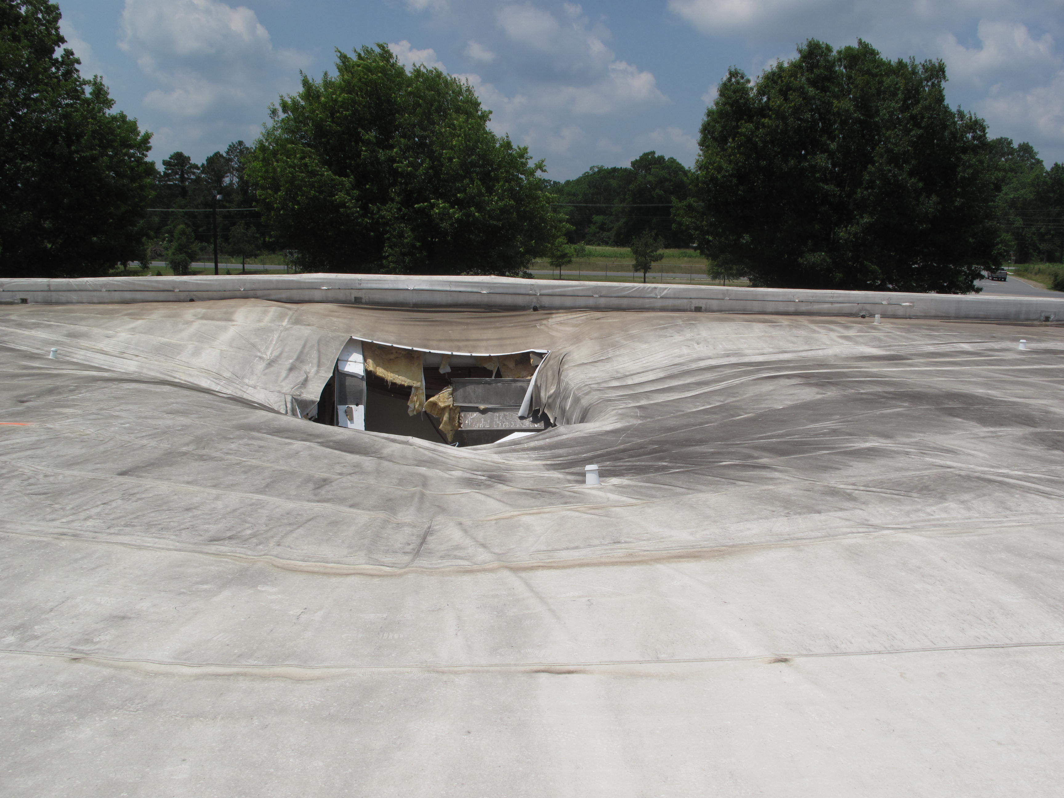 The Risks of Using Single-Ply Over Metal Roofs