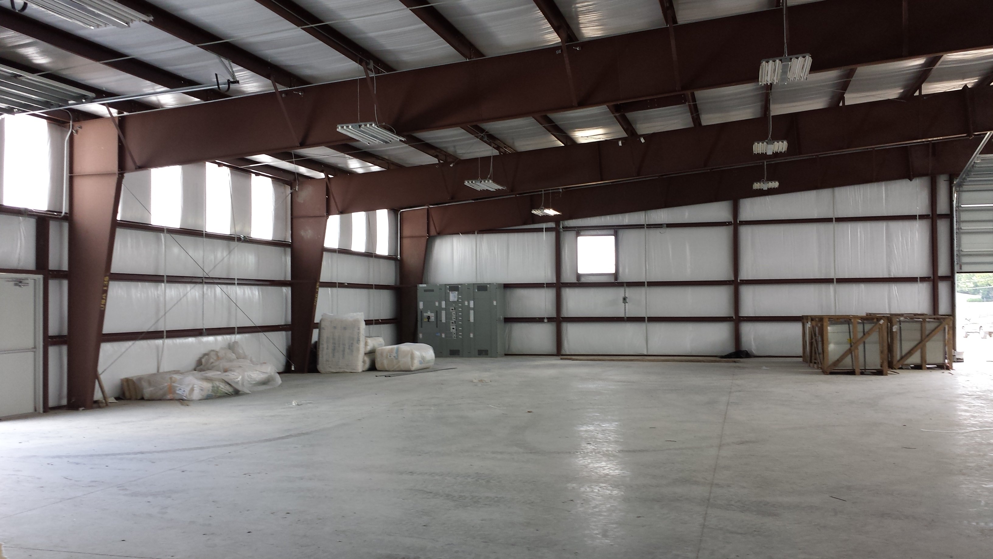 Installing a Membrane Roof over a Metal Roof on a Pre-Engineered Metal Building